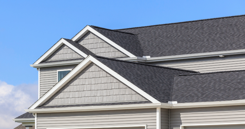 upper part of home with roof and gutters